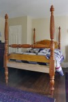 Tall post bed, made of cherry and bird's eye maple.